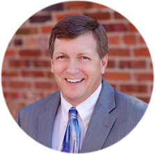 BRUCE E. SIMMONS
